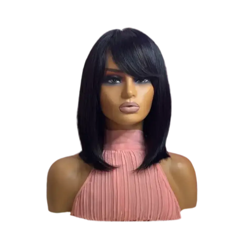 Black wig on a mannequin head with a pink top against a white background