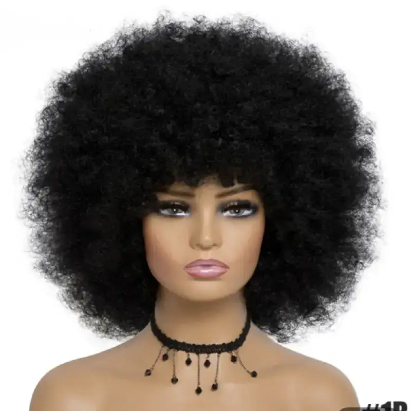 Foxy Cleo short afro wig with voluminous kinky curls and playful bangs, offering a bold, textured style in 17 color options