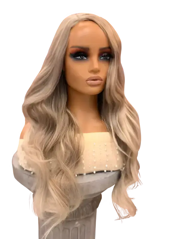 Kim Wig Synthetic Long, layered style with loose waves and subtle volume.