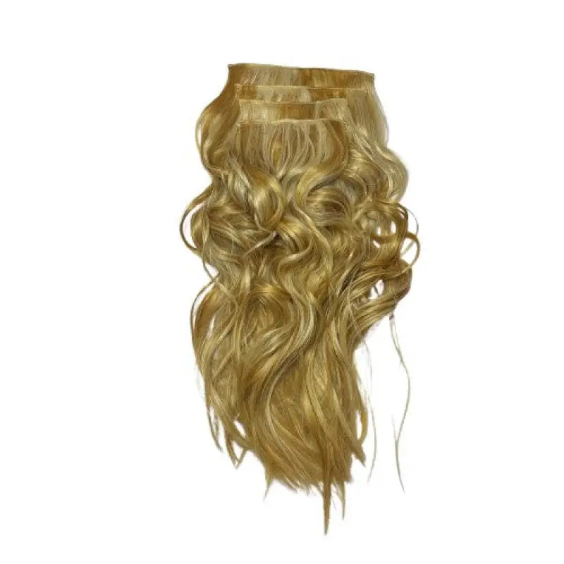 Blonde hair extensions on a white surface